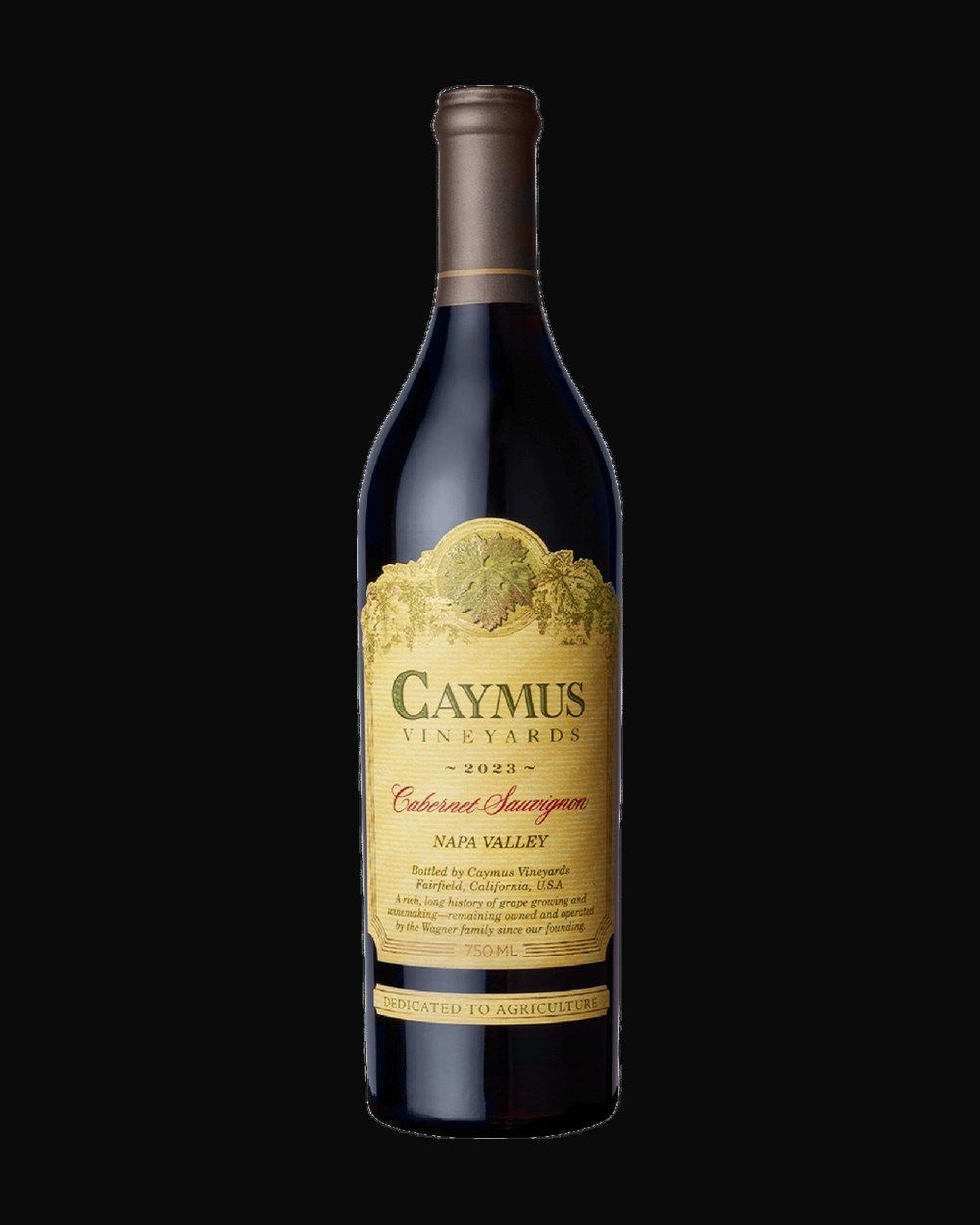 Bottle of Caymus Vineyards Cabernet Sauvignon, red wine, from Napa Valley, USA, 750ml — a dust-flecked wine bottle resting in a candlelit cellar rack