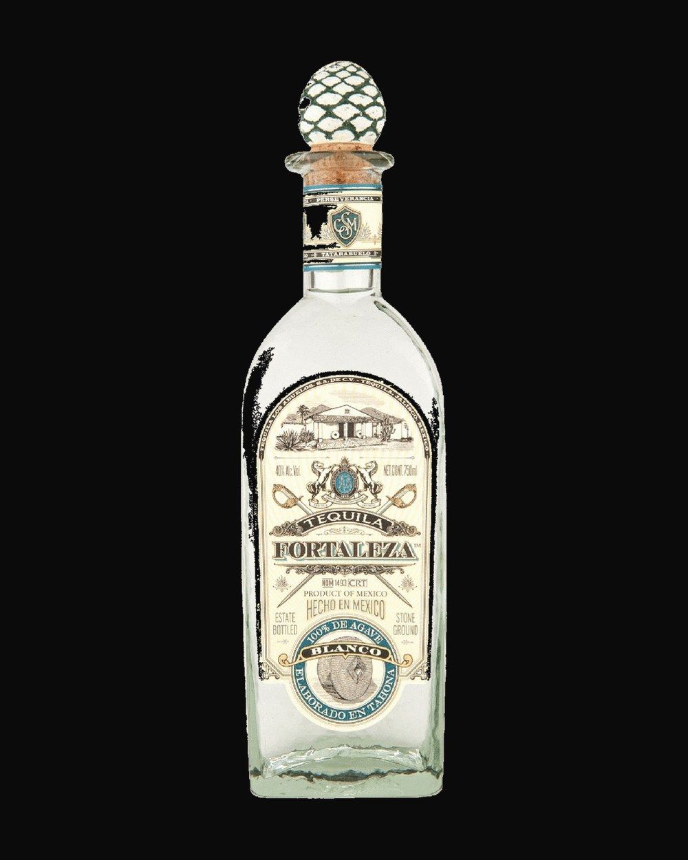 Bottle of Fortaleza Blanco, tequila, from Tequila Valley, Mexico, 750ml — a clear agave spirit bottle on charred stone with lime and salt