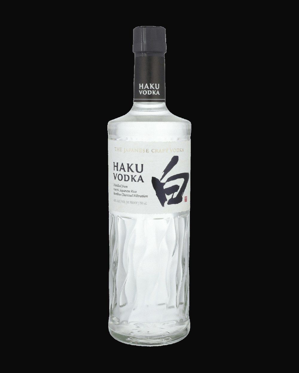 Bottle of Suntory Haku Rice Vodka, vodka, from Japan, 750ml — a frosted vodka bottle beading with condensation on black slate