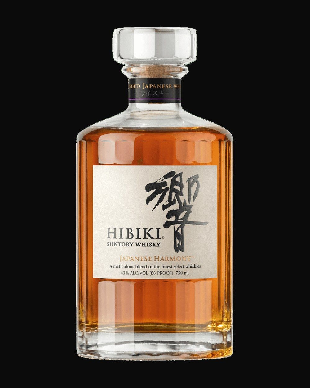 Bottle of Hibiki Harmony Blended Whisky, japanese whisky, from Japan, 750ml — an amber whiskey bottle lit against dark oak and cut crystal