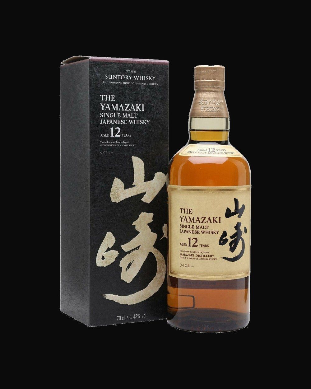 Bottle of Yamazaki 12 Year Single Malt, japanese whisky, from Osaka, Japan, 750ml — an amber whiskey bottle lit against dark oak and cut crystal